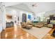 Spacious living room with hardwood floors, high ceilings, and ample seating arrangements at 3420 Maryhurst Ln, Charlotte, NC 28226