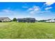 A well-maintained backyard with green grass and a back view of the house at 3615 Kimber Ln, Sherrills Ford, NC 28673