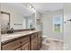 Spacious bathroom features a dual sink vanity with granite counters, a large mirror, and an abundance of storage at 3615 Kimber Ln, Sherrills Ford, NC 28673