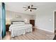 A Primary bedroom with wood flooring, a ceiling fan, and natural light through large windows at 3615 Kimber Ln, Sherrills Ford, NC 28673