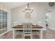 A dining room with wood flooring, a chandelier, and a table set for four at 3615 Kimber Ln, Sherrills Ford, NC 28673