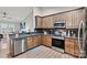 Modern kitchen features stainless appliances, granite countertops, dark backsplash, and ample cabinet space at 3615 Kimber Ln, Sherrills Ford, NC 28673