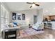 Open concept living room featuring hardwood floors, neutral paint, and seamless flow to the kitchen at 3615 Kimber Ln, Sherrills Ford, NC 28673