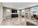 Bright living room featuring hardwood flooring, light-colored walls, and TV at 3615 Kimber Ln, Sherrills Ford, NC 28673