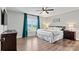 Cozy bedroom showcases neutral colors, ample light from a window, hardwood floors, and matching furniture for a serene retreat at 3615 Kimber Ln, Sherrills Ford, NC 28673