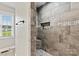 Luxurious shower has attractive tile work and a built-in niche for toiletries at 3615 Kimber Ln, Sherrills Ford, NC 28673