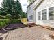 A beautiful back patio and stained deck provide serene spots for outdoor relaxation and entertainment at 6005 Abergele Ln, Matthews, NC 28104