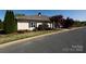 A charming clubhouse with manicured landscaping and a welcoming facade at 6005 Abergele Ln, Matthews, NC 28104