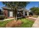 The brick clubhouse boasts a welcoming entrance, surrounded by landscaping, providing a community focal point at 6005 Abergele Ln, Matthews, NC 28104