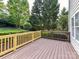 Spacious wooden deck with decorative railing and a view of the backyard at 6005 Abergele Ln, Matthews, NC 28104