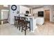 Eat-in kitchen with barstool seating and modern appliances at 6005 Abergele Ln, Matthews, NC 28104