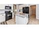 Bright kitchen features granite countertops, black appliances, and white cabinets at 6005 Abergele Ln, Matthews, NC 28104