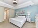 Bright bedroom with tray ceilings, soft colors, and plenty of natural light at 6005 Abergele Ln, Matthews, NC 28104