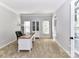 Well-lit office with a built-in bookcase and a large desk at 6005 Abergele Ln, Matthews, NC 28104