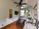 View of a covered patio with comfortable seating, ceiling fan, and backyard at 6005 Abergele Ln, Matthews, NC 28104
