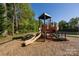 Community playground featuring a slide and climbing structure, perfect for outdoor fun at 6005 Abergele Ln, Matthews, NC 28104
