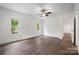 Bedroom with hardwood floors, ceiling fan and three windows at 6712 Cove Ln, Sherrills Ford, NC 28673