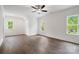 Spacious bedroom with hardwood floors, ceiling fan and three windows at 6712 Cove Ln, Sherrills Ford, NC 28673