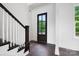 Elegant entryway featuring a modern staircase and a stylish front door with glass panels at 6712 Cove Ln, Sherrills Ford, NC 28673