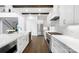 Bright kitchen with hardwood floors, white cabinets, and stainless steel appliances at 6712 Cove Ln, Sherrills Ford, NC 28673