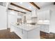 Modern kitchen featuring a large island, quartz countertops, and stainless steel appliances at 6712 Cove Ln, Sherrills Ford, NC 28673