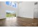 Open living area with hardwood floors, high ceilings, and access to outdoor living space at 6712 Cove Ln, Sherrills Ford, NC 28673