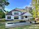 Luxurious backyard oasis with a modern pool, waterfall feature, and comfortable lounge chairs at 6712 Cove Ln, Sherrills Ford, NC 28673