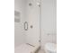 Modern shower features glass door, tile surround, and built-in shelving at 6712 Cove Ln, Sherrills Ford, NC 28673