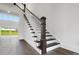 Beautiful staircase featuring dark wood treads, and a large picture window at 6712 Cove Ln, Sherrills Ford, NC 28673