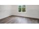 Walk-in closet features shelving, a window and hardwood floors at 6712 Cove Ln, Sherrills Ford, NC 28673