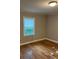 Bedroom featuring wood floor and a window with blinds at 755 Victory Grove Church Rd, Lincolnton, NC 28092