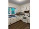 Kitchen featuring white cabinets and modern appliances at 755 Victory Grove Church Rd, Lincolnton, NC 28092