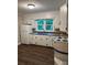 Kitchen featuring white cabinets, a double stainless steel sink and modern appliances at 755 Victory Grove Church Rd, Lincolnton, NC 28092