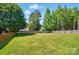 Expansive backyard featuring a well-maintained lawn and secure wooden fencing at 8004 Fountainbrook Dr # 15, Indian Trail, NC 28079