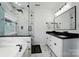 Luxurious bathroom with marble accents, glass shower, dual sinks, and modern fixtures at 8004 Fountainbrook Dr # 15, Indian Trail, NC 28079