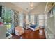 Bright bedroom with vaulted ceilings, hardwood floors, and large windows with patterned curtains at 8004 Fountainbrook Dr # 15, Indian Trail, NC 28079