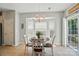 Cozy dining area with bay window, chandelier, and access to the outdoor space at 8004 Fountainbrook Dr # 15, Indian Trail, NC 28079