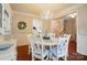 Elegant dining room with white table, chairs, and wainscoting at 8004 Fountainbrook Dr # 15, Indian Trail, NC 28079