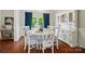 Elegant dining room with white table, chairs, hutch, and blue accents at 8004 Fountainbrook Dr # 15, Indian Trail, NC 28079