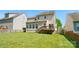 Home's exterior view from the backyard featuring a deck, well-kept lawn and neutral color palette at 8004 Fountainbrook Dr # 15, Indian Trail, NC 28079
