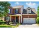 Charming two-story brick home with front porch, landscaped garden and a two-car garage at 8004 Fountainbrook Dr # 15, Indian Trail, NC 28079