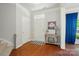 Inviting foyer with hardwood floors and a charming welcome table at 8004 Fountainbrook Dr # 15, Indian Trail, NC 28079