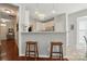 Modern kitchen featuring a breakfast bar with wooden stools at 8004 Fountainbrook Dr # 15, Indian Trail, NC 28079