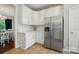 Bright kitchen with white cabinets, stainless steel refrigerator, and white countertops at 8004 Fountainbrook Dr # 15, Indian Trail, NC 28079
