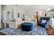 Comfortable living room with sectional sofa, blue ottoman, and patterned rug at 8004 Fountainbrook Dr # 15, Indian Trail, NC 28079