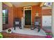 Charming porch with rocking chairs and a welcoming sign at 8004 Fountainbrook Dr # 15, Indian Trail, NC 28079