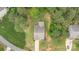 Overhead aerial view of the home showing its landscaping and driveway with a view of neighboring homes and greenery at 8112 Mossy Rock Rd, Waxhaw, NC 28173