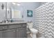 Bathroom featuring granite countertop, grey cabinetry, and tile flooring at 8112 Mossy Rock Rd, Waxhaw, NC 28173