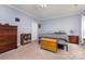 Bedroom with carpet flooring, dresser, and a window providing natural light at 8112 Mossy Rock Rd, Waxhaw, NC 28173