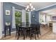 Charming dining room with a chandelier, wood-look floors, and ample natural light, perfect for gatherings at 8112 Mossy Rock Rd, Waxhaw, NC 28173